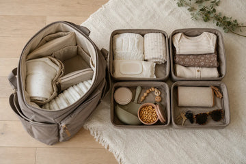Open nappy bag beside four organised pouches for changing, clothing, snacks and parent essentials